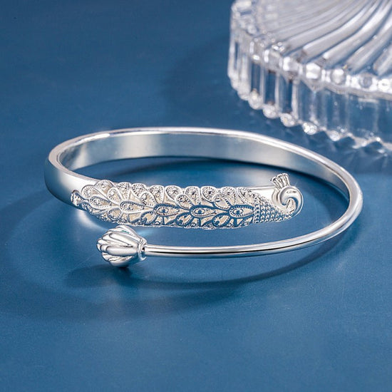 Charm Embossed Peacock Bracelet Female Ethnic $19.00 Dana Fashion Color: Cooperized Silver Colors Women's Accessories Product information: Treatment Process: Electroplating Color: cooperation silver color Material: Copper Popular elements: Auspicious Pack