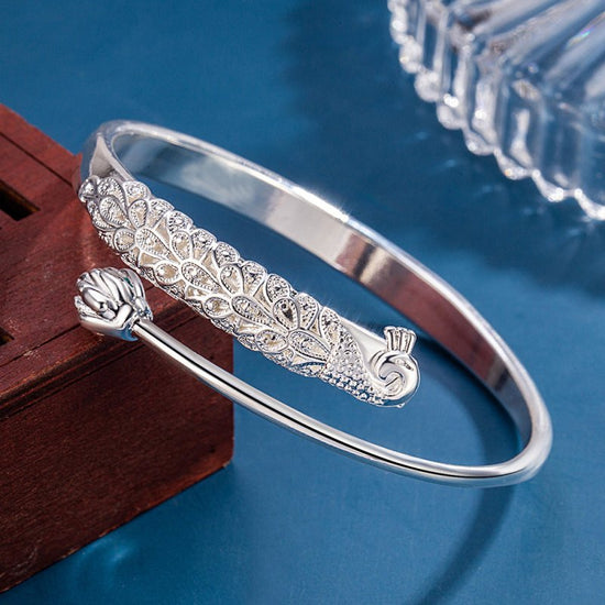 Charm Embossed Peacock Bracelet Female Ethnic $19.00 Dana Fashion Color: Cooperized Silver Colors Women's Accessories Product information: Treatment Process: Electroplating Color: cooperation silver color Material: Copper Popular elements: Auspicious Pack
