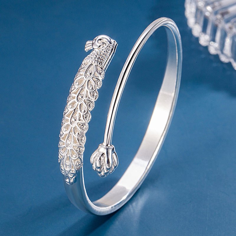Charm Embossed Peacock Bracelet Female Ethnic $19.00 Dana Fashion Color: Cooperized Silver Colors Women's Accessories Product information: Treatment Process: Electroplating Color: cooperation silver color Material: Copper Popular elements: Auspicious Pack