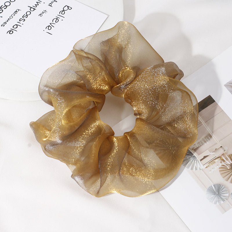 Chiffon Oversized Organza Spring And Summer New Simple Hair Accessories $8.00 Dana Fashion Color: Gold Women's Accessories Product information: Processing Technology: Handmade Color: 1# Orange large intestine hair ring, 2# purple large intestine hair ring