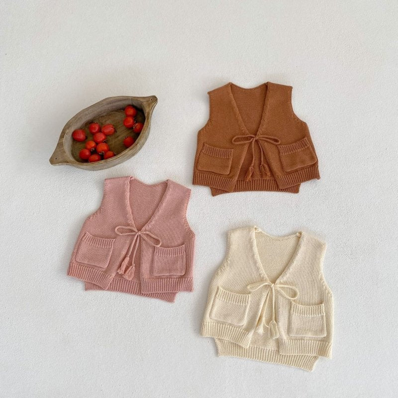 Children's Cardigan Knitted Tassel Tie Vest $30.55 Dana Fashion Color: Apricot White Child size: 100cm Baby Clothing Product information: Fabric name: Cotton Main fabric composition: cotton Main fabric component content: 100% Collar type: V-shaped collar