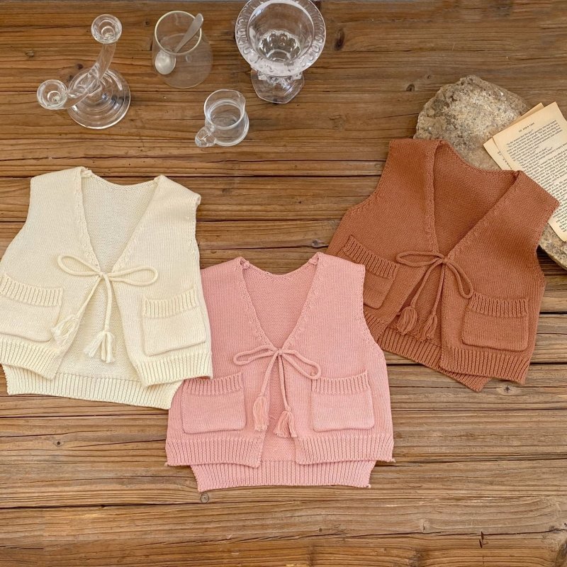 Children's Cardigan Knitted Tassel Tie Vest $30.55 Dana Fashion Color: Apricot White Child size: 100cm Baby Clothing Product information: Fabric name: Cotton Main fabric composition: cotton Main fabric component content: 100% Collar type: V-shaped collar
