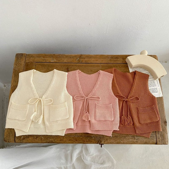 Children's Cardigan Knitted Tassel Tie Vest $30.55 Dana Fashion Color: Apricot White Child size: 100cm Baby Clothing Product information: Fabric name: Cotton Main fabric composition: cotton Main fabric component content: 100% Collar type: V-shaped collar