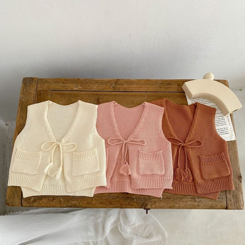 Children's Cardigan Knitted Tassel Tie Vest $30.55 Dana Fashion Color: Apricot White Child size: 100cm Baby Clothing Product information: Fabric name: Cotton Main fabric composition: cotton Main fabric component content: 100% Collar type: V-shaped collar
