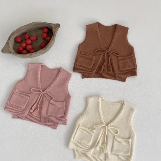 Children's Cardigan Knitted Tassel Tie Vest $30.55 Dana Fashion Color: Apricot White Child size: 100cm Baby Clothing Product information: Fabric name: Cotton Main fabric composition: cotton Main fabric component content: 100% Collar type: V-shaped collar