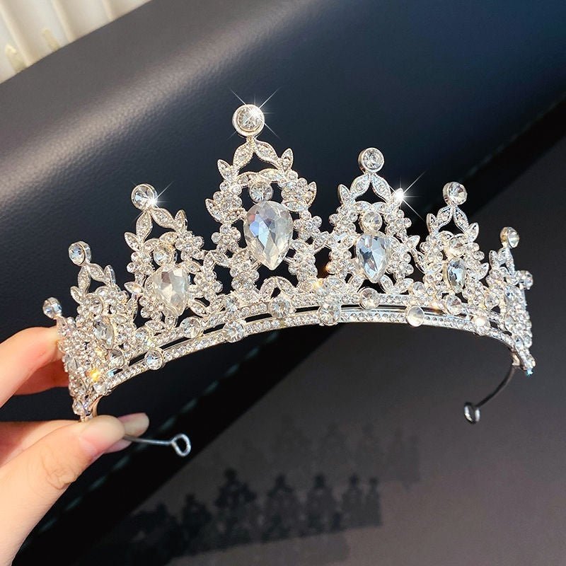 Children's Children's Crown Headdress Girls Princess Crown Hair Clip $23.50 Dana Fashion Color: 7Great Diamond Crown Women's Accessories Product information: Pattern: Cross/Crown/Roman numerals Treatment Process: Electroplating Type: Hair accessories suit