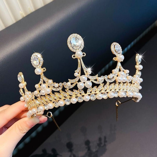 Children's Children's Crown Headdress Girls Princess Crown Hair Clip $23.50 Dana Fashion Color: 9Gold Diamond Pearl Crown Women's Accessories Product information: Pattern: Cross/Crown/Roman numerals Treatment Process: Electroplating Type: Hair accessories