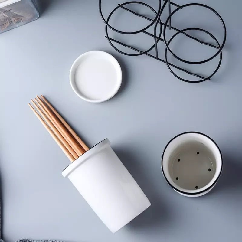 Chopsticks, knife, fork and spoon storage rack $26.36 Dana Fashion Color: White Dana's Kitchen Material: Ceramic Product advantages: 1. Smaller, more application scenarios 2. No need to wait for the plate to dry before storage 3. Automatically drain exces