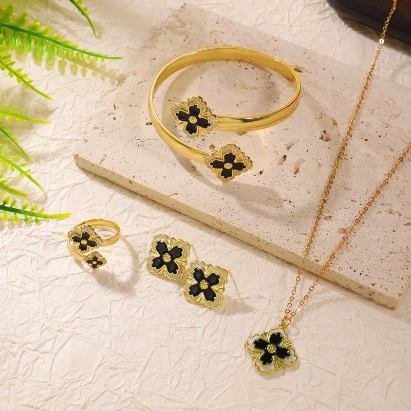 Clover Bracelet Earring Set $20.50 Dana Fashion Color: Black White Women's Accessories Product attributes Type: Jewelry Set Material: Alloy Inlay material: Drip oil Brand: Jiutong Shape: Flower Processing technology: Electroplating Origin: Yiwu Style: Wom