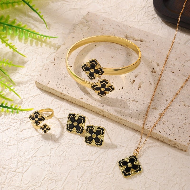 Clover Bracelet Earring Set $20.50 Dana Fashion Color: Black Women's Accessories Product attributes Type: Jewelry Set Material: Alloy Inlay material: Drip oil Brand: Jiutong Shape: Flower Processing technology: Electroplating Origin: Yiwu Style: Women's M