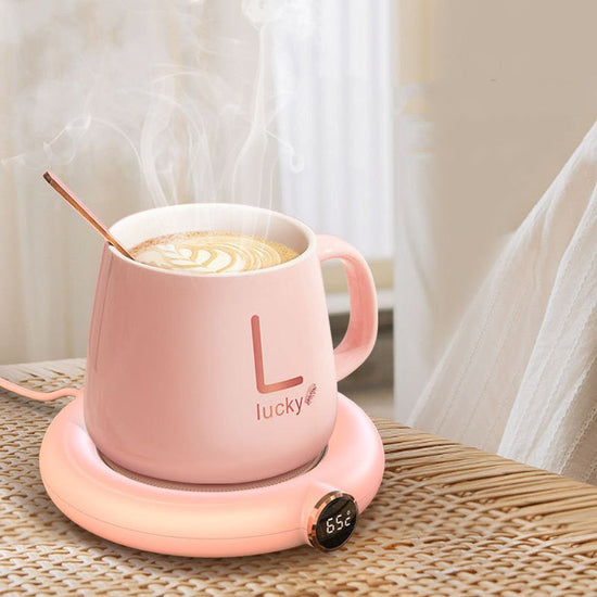 Coffee Mug Warmer Warm Coaster Smart Heating Cup Thermal Insulation Constant Temperature Coaster Heating Pad Desktop $40.00 Dana Fashion Color: M306 Pink Electrical outlet: USB Dana's Kitchen Overview: - Keep your coffee warm all morning long with this sl