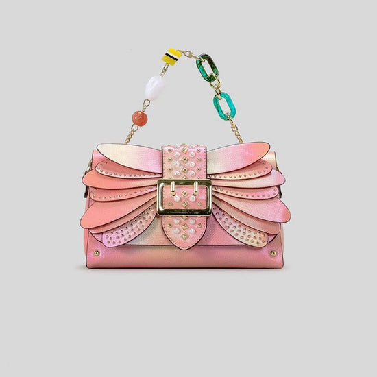 Contrast Color Heavy Industry Manual Rivet Butterfly Wings Handbag $99.00 Dana Fashion Color: Pink Women's Bags Product information: Applicable scenario: leisure travel Color: pink, purple Outer bag type: open pocket Hardness: medium hard Material: PU Sui