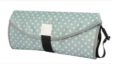 Convenient baby changing pad $27.27 Dana Fashion Color: Light green dots Baby & Mother Name: Convenient baby changing pad Material: 420 Oxford + 190 waterproof cloth Weight: 145 grams Expanded size: 64 * 70 cm Folding size: 38 * 17cm Packaging: OPP bag in