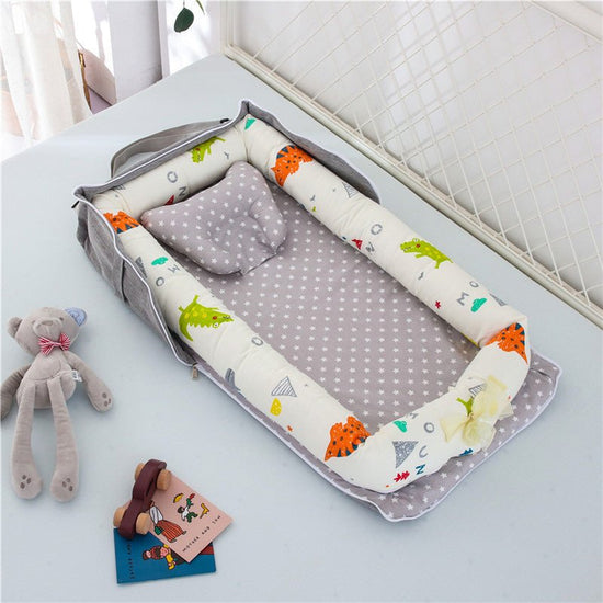 Cotton Portable Baby Crib Newborn Foldable $110.33 Dana Fashion Color: Dinosaur Baby & Mother Overview： Anti-pressure crib, professionally care for your baby Protective isolation, comfortable sleep Adjustable crossbody shoulder strap Give babies a sense o