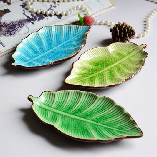 Creative Banana Leaf Shape Ceramic Plate Lovely Seasoning Dish $13.50 Dana Fashion Color: Green Dana's Kitchen Overview creative light luxury apple watermelon modeling decoration, can do desktop decoration pieces, practical at the same time is also beauti