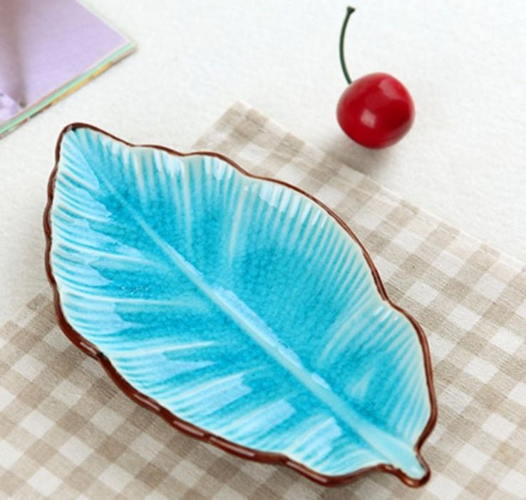 Creative Banana Leaf Shape Ceramic Plate Lovely Seasoning Dish $13.50 Dana Fashion Color: Lake Blue Dana's Kitchen Overview creative light luxury apple watermelon modeling decoration, can do desktop decoration pieces, practical at the same time is also be