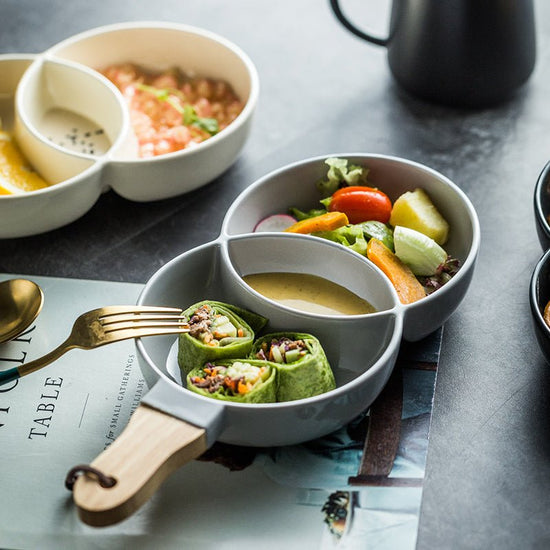 Creative cutlery tray for household tableware $35.50 Dana Fashion Color: Cream color Dana's Kitchen Material: Porcelain Applicable objects: adult plate Type: Soup plate tea tableware Process: color glaze