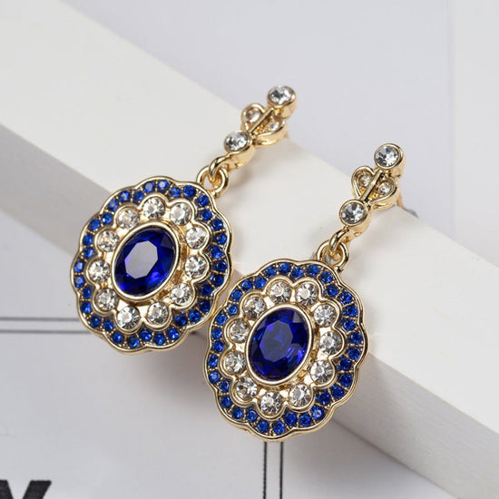 Creative Sapphire Fashion Diamond Jewelry Women's Earrings $12.02 Dana Fashion Color: Sapphire Blue Women's Accessories Product information: Treatment Process: Electroplating Color: Sapphire Blue Applicable people: women Material: electroplated Platinum S