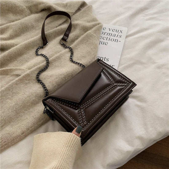 Cross-body rivet bag for lady $38.25 Dana Fashion Color: Black Women's Bags Fabric texture: PU The width of the height The thickness of the 19.5 14 7 unit：cm 1.Please allow 2-3cm differences due to manual measurement. 2. Please check the size chart carefu