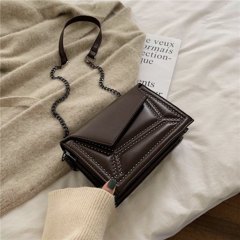 Cross-body rivet bag for lady $38.25 Dana Fashion Color: Black Women's Bags Fabric texture: PU The width of the height The thickness of the 19.5 14 7 unit：cm 1.Please allow 2-3cm differences due to manual measurement. 2. Please check the size chart carefu