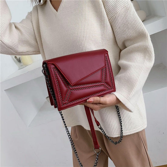 Cross-body rivet bag for lady $38.25 Dana Fashion Color: Wine red Women's Bags Fabric texture: PU The width of the height The thickness of the 19.5 14 7 unit：cm 1.Please allow 2-3cm differences due to manual measurement. 2. Please check the size chart car