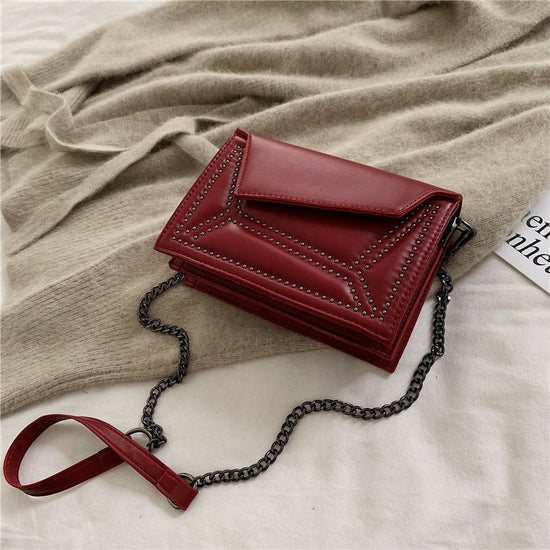 Cross-body rivet bag for lady $38.25 Dana Fashion Color: Black Women's Bags Fabric texture: PU The width of the height The thickness of the 19.5 14 7 unit：cm 1.Please allow 2-3cm differences due to manual measurement. 2. Please check the size chart carefu