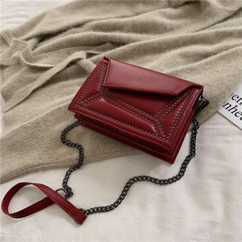 Cross-body rivet bag for lady $38.25 Dana Fashion Color: Black Women's Bags Fabric texture: PU The width of the height The thickness of the 19.5 14 7 unit：cm 1.Please allow 2-3cm differences due to manual measurement. 2. Please check the size chart carefu