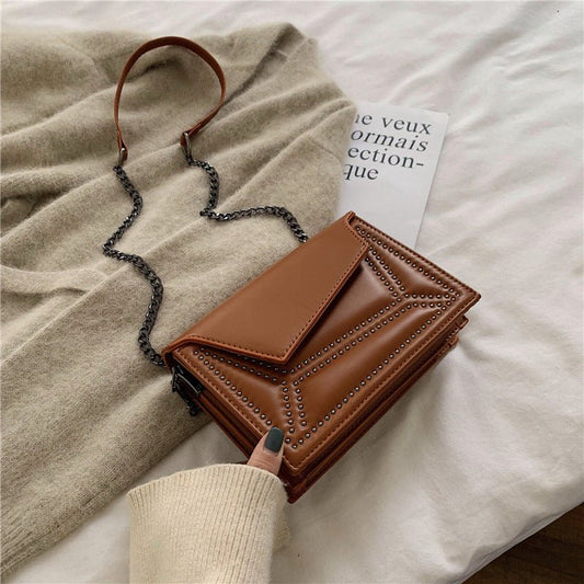 Cross-body rivet bag for lady $38.25 Dana Fashion Color: Black Women's Bags Fabric texture: PU The width of the height The thickness of the 19.5 14 7 unit：cm 1.Please allow 2-3cm differences due to manual measurement. 2. Please check the size chart carefu