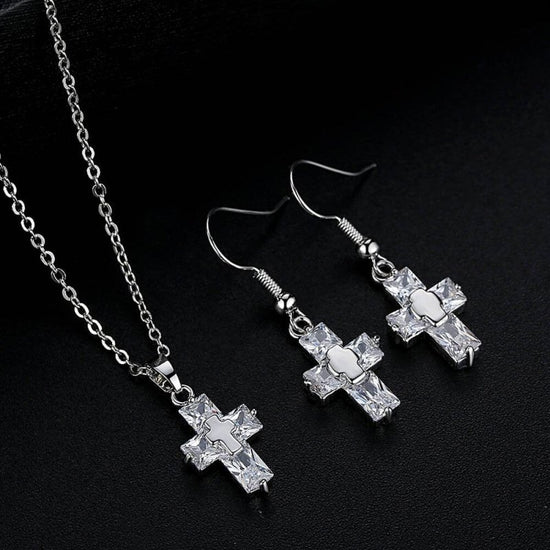 Cross ornament set $25.99 Dana Fashion Color: Sliver Beauty Tools Name: Cross Set Material: raw material is copper, surface plating treatment Color: gold, silver Size: Pendant: 1.2 * 2.2cm, Studs: 3.3 * 1.2 cm