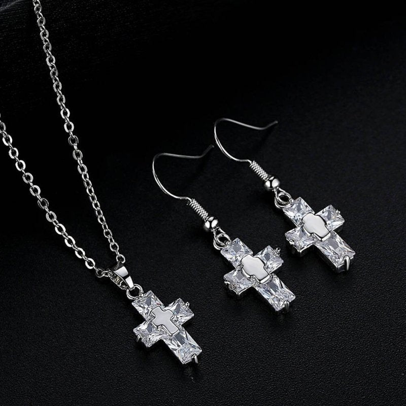 Cross ornament set $25.99 Dana Fashion Color: Sliver Beauty Tools Name: Cross Set Material: raw material is copper, surface plating treatment Color: gold, silver Size: Pendant: 1.2 * 2.2cm, Studs: 3.3 * 1.2 cm