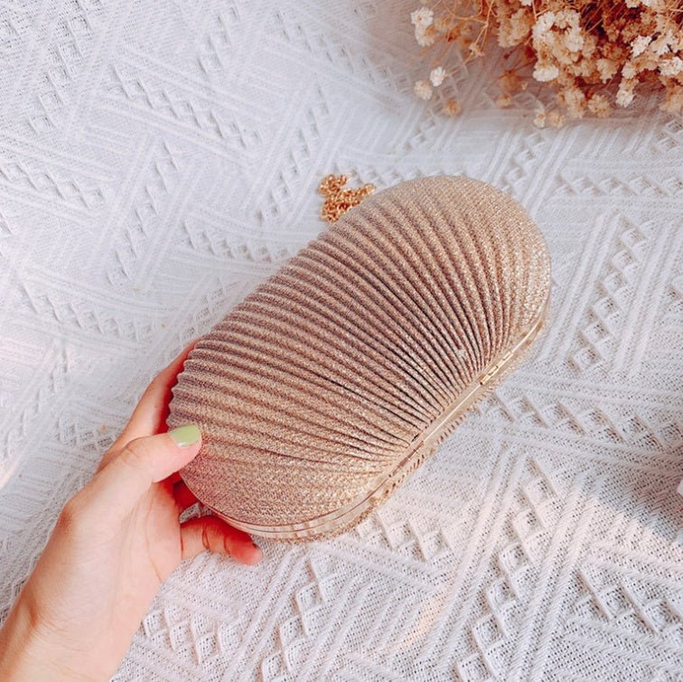 Crossbody Frosted Clutch $52.38 Dana Fashion Color: Gold Women's Bags Material: Polyester Color: oval can fit 4.7 inches Package contents: 1 * evening bag Only the contents of the package above, the other products are not included. Note: Light shooting an