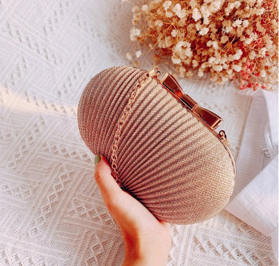 Crossbody Frosted Clutch $52.38 Dana Fashion Color: Gold Women's Bags Material: Polyester Color: oval can fit 4.7 inches Package contents: 1 * evening bag Only the contents of the package above, the other products are not included. Note: Light shooting an