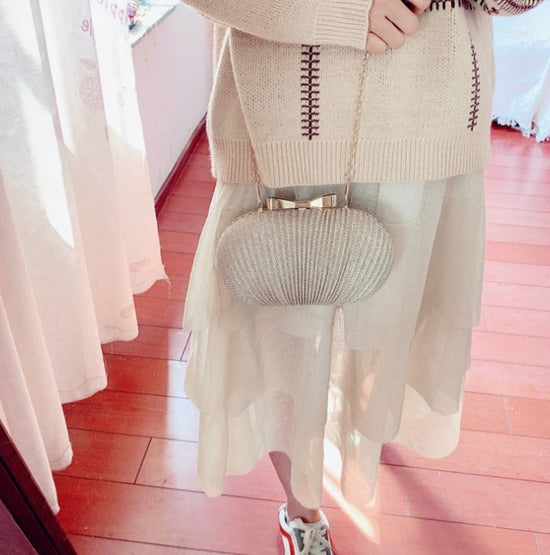 Crossbody Frosted Clutch $52.38 Dana Fashion Color: Gold Women's Bags Material: Polyester Color: oval can fit 4.7 inches Package contents: 1 * evening bag Only the contents of the package above, the other products are not included. Note: Light shooting an