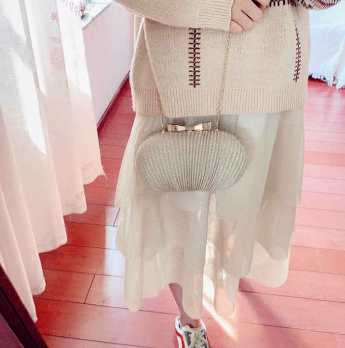Crossbody Frosted Clutch $52.38 Dana Fashion Color: Gold Women's Bags Material: Polyester Color: oval can fit 4.7 inches Package contents: 1 * evening bag Only the contents of the package above, the other products are not included. Note: Light shooting an