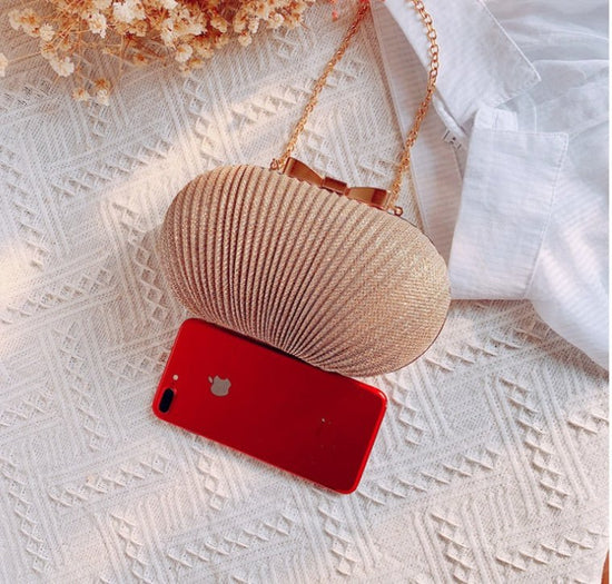 Crossbody Frosted Clutch $52.38 Dana Fashion Color: Gold Women's Bags Material: Polyester Color: oval can fit 4.7 inches Package contents: 1 * evening bag Only the contents of the package above, the other products are not included. Note: Light shooting an