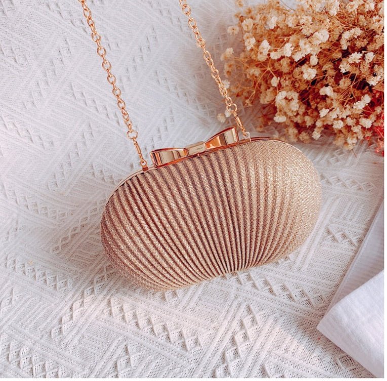 Crossbody Frosted Clutch $52.38 Dana Fashion Color: Gold Women's Bags Material: Polyester Color: oval can fit 4.7 inches Package contents: 1 * evening bag Only the contents of the package above, the other products are not included. Note: Light shooting an