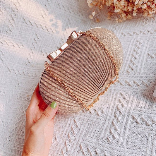Crossbody Frosted Clutch $52.38 Dana Fashion Color: Gold Women's Bags Material: Polyester Color: oval can fit 4.7 inches Package contents: 1 * evening bag Only the contents of the package above, the other products are not included. Note: Light shooting an