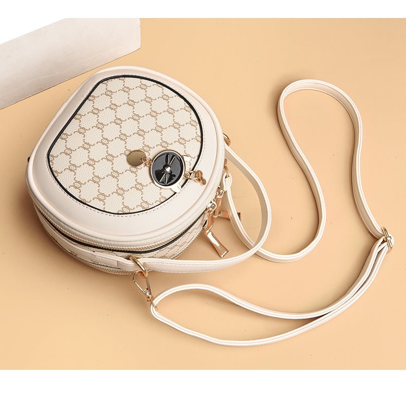 Crossbody Portable Printed Small Round Bag Soft Leather $44.52 Dana Fashion Color: Bear White Women's shoes Product information: Applicable scenarios: Daily matching Color: TMK Brown, rhombus White, bear White, Diamond Blue, MX Brown Material: PU Style: U