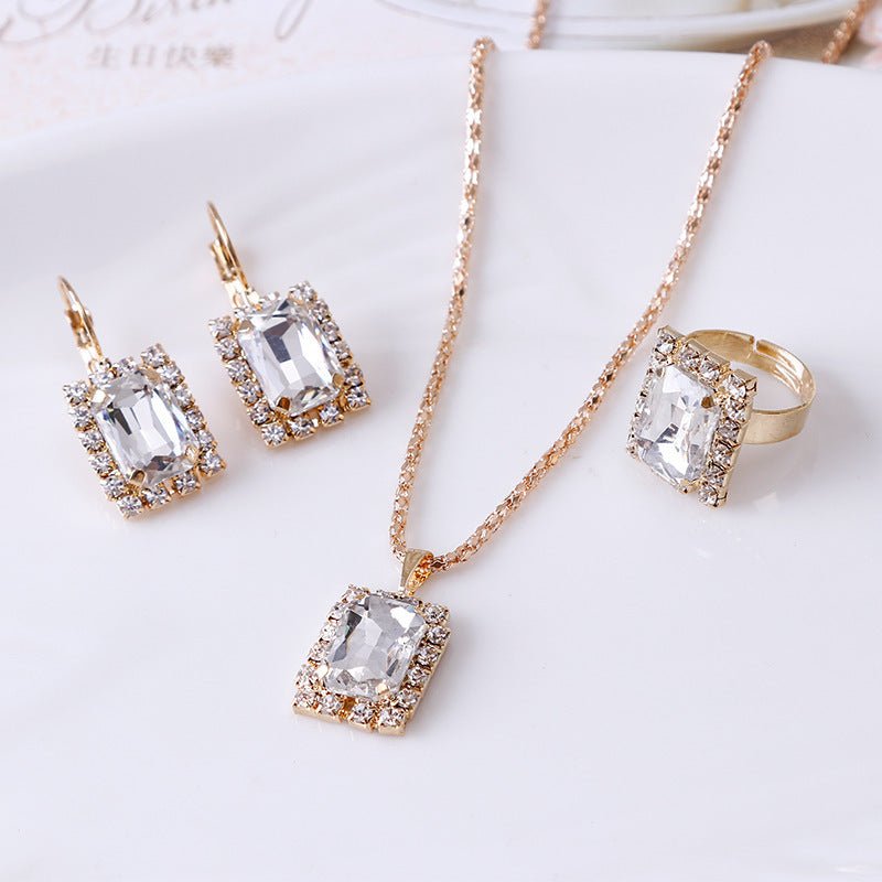 Crystal bridal necklace earring ring three piece set $25.00 Dana Fashion Color: White Women's Accessories Setting material: alloy inlaid artificial gems / semi-precious stones Circumference 51cm (inclusive)-80cm (inclusive) Extension chain below 10cm Pend