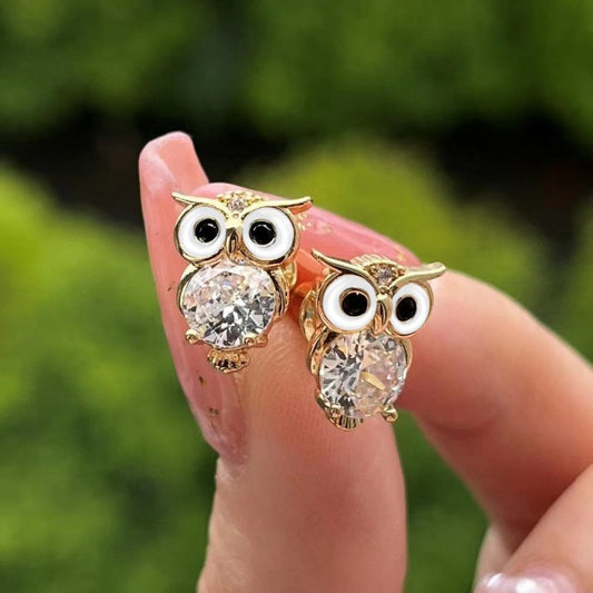 Cute With Diamonds Zircon Owl Stud Earrings For Women $20.00 Dana Fashion Color: E1897 Gold Women's Accessories Product information: Color: E1897 gold Material: Copper Modeling: animal/Zodiac Popular elements: Owl Style: Cartoon Packing list: Earrings*1 p