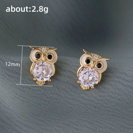 Cute With Diamonds Zircon Owl Stud Earrings For Women $20.00 Dana Fashion Color: E1897 Gold Women's Accessories Product information: Color: E1897 gold Material: Copper Modeling: animal/Zodiac Popular elements: Owl Style: Cartoon Packing list: Earrings*1 p