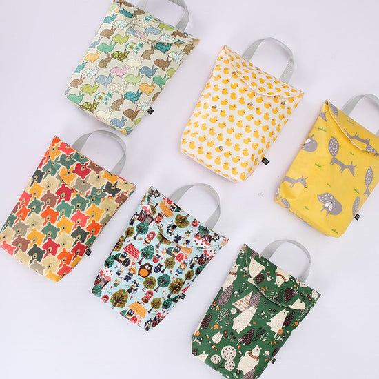 Diaper storage bag $14.58 Dana Fashion Color: Bear navy Baby & Mother Fabric: Cotton waterproof composite fabric Size: 24 * 19 * 6CM. Lining: polyester Sealing: Velcro closure Composition: one main bag, plastic bag
