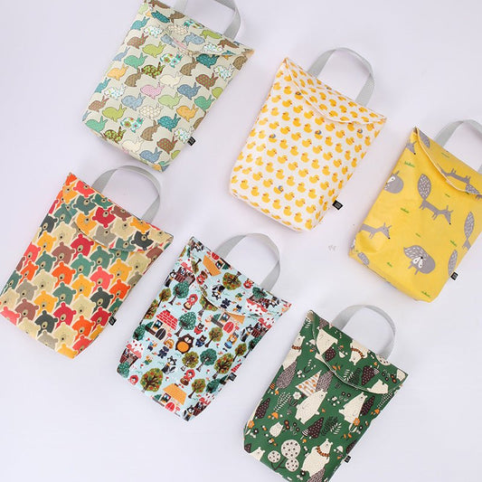 Diaper storage bag $14.58 Dana Fashion Color: Bear navy Baby & Mother Fabric: Cotton waterproof composite fabric Size: 24 * 19 * 6CM. Lining: polyester Sealing: Velcro closure Composition: one main bag, plastic bag