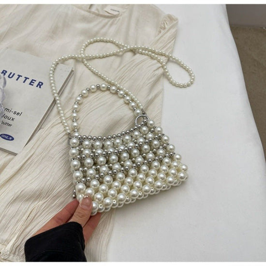 Dinner Luxury Pearl Women's Bag $40.73 Dana Fashion Color: Silver Women's Bags Product information: Lining texture: without lining Applicable scenarios: Daily matching Color: creamy-white, Silver Hardness: soft Material: acrylic Suitcase shape: Horizontal