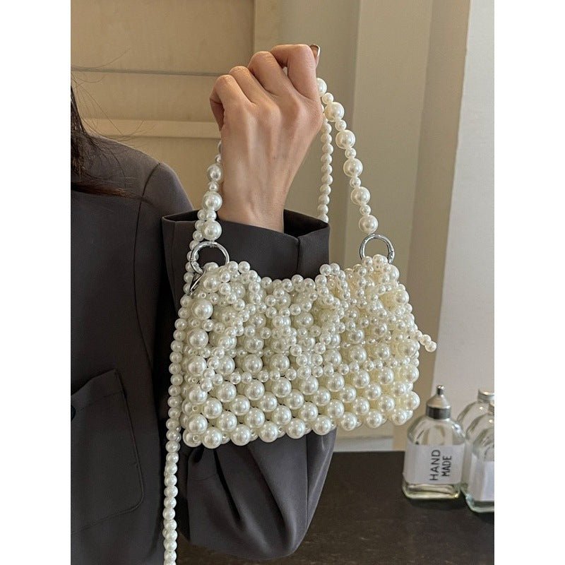 Dinner Luxury Pearl Women's Bag $40.73 Dana Fashion Color: Beige Women's Bags Product information: Lining texture: without lining Applicable scenarios: Daily matching Color: creamy-white, Silver Hardness: soft Material: acrylic Suitcase shape: Horizontal