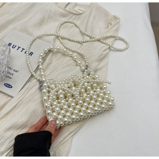 Dinner Luxury Pearl Women's Bag $40.73 Dana Fashion Color: Beige Women's Bags Product information: Lining texture: without lining Applicable scenarios: Daily matching Color: creamy-white, Silver Hardness: soft Material: acrylic Suitcase shape: Horizontal