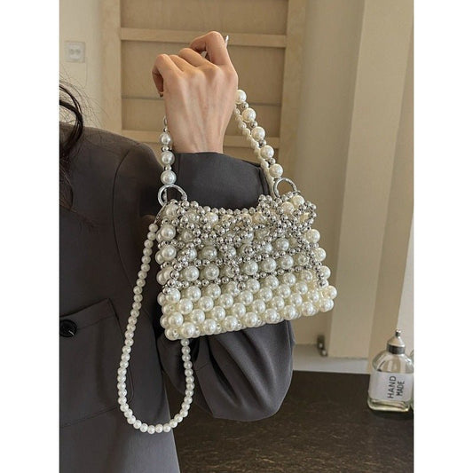 Dinner Luxury Pearl Women's Bag $40.73 Dana Fashion Color: Beige Women's Bags Product information: Lining texture: without lining Applicable scenarios: Daily matching Color: creamy-white, Silver Hardness: soft Material: acrylic Suitcase shape: Horizontal