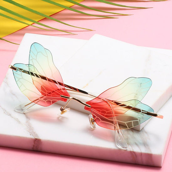 Dragonfly wings sunglasses $25.50 Dana Fashion Color: GLOD BROWN Women's Accessories Specification: Adult Glasses structure: frame Whether it is polarized: No Lens material: PC Style: personality Frame material: metal Anti-UV grade: UV400 Style: General V