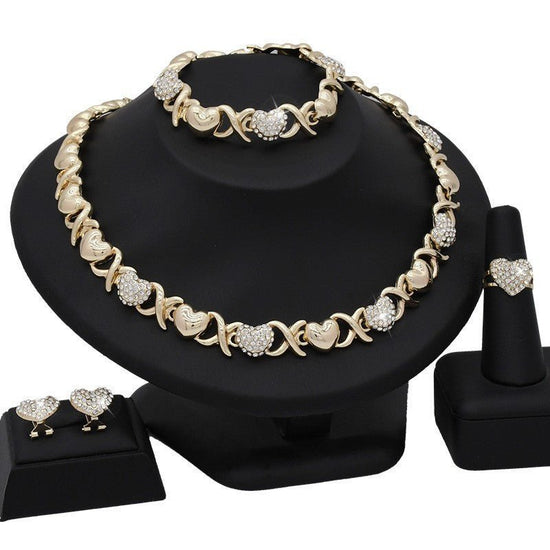 Dubai 18K Gold Heart-shaped Jewelry Suit $59.00 Dana Fashion Color: X12 Light Gold Women's Accessories Product information: Pattern: as shown in the figure Treatment Process: Electroplating Chain style: water wave chain Material: Alloy Applicable people: