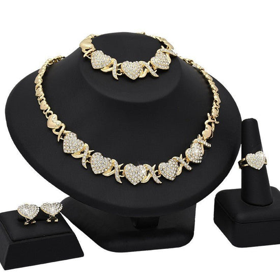 Dubai 18K Gold Heart-shaped Jewelry Suit $59.00 Dana Fashion Color: X13 Light Gold Women's Accessories Product information: Pattern: as shown in the figure Treatment Process: Electroplating Chain style: water wave chain Material: Alloy Applicable people: